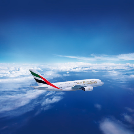 Emirates Airbus A 380 over clouds